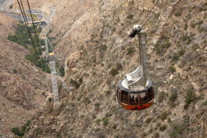 aerial tramway descending among mountains