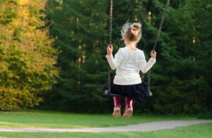 Girl swinging at a park