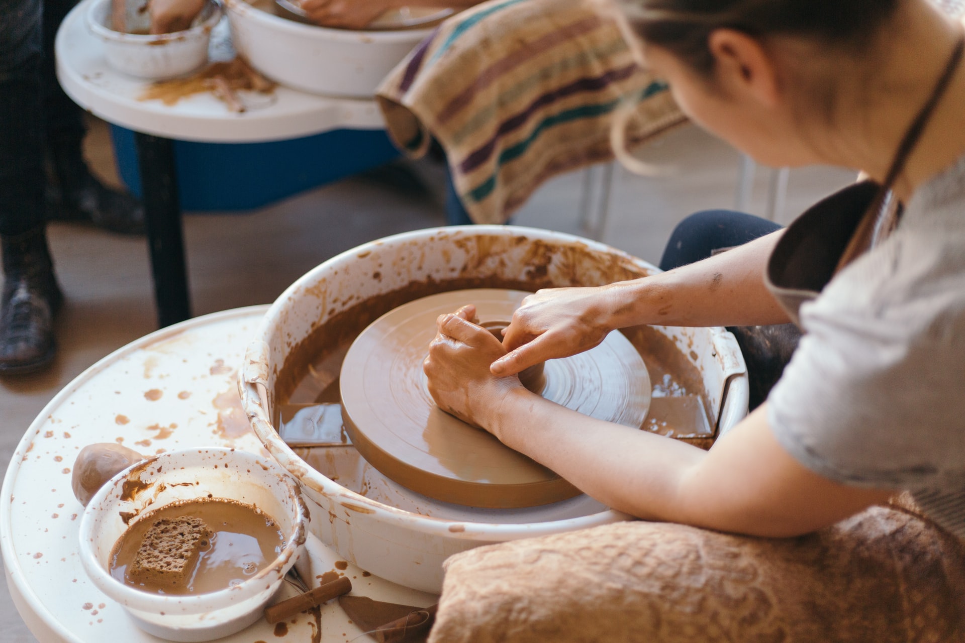 pottery wheel used by woman