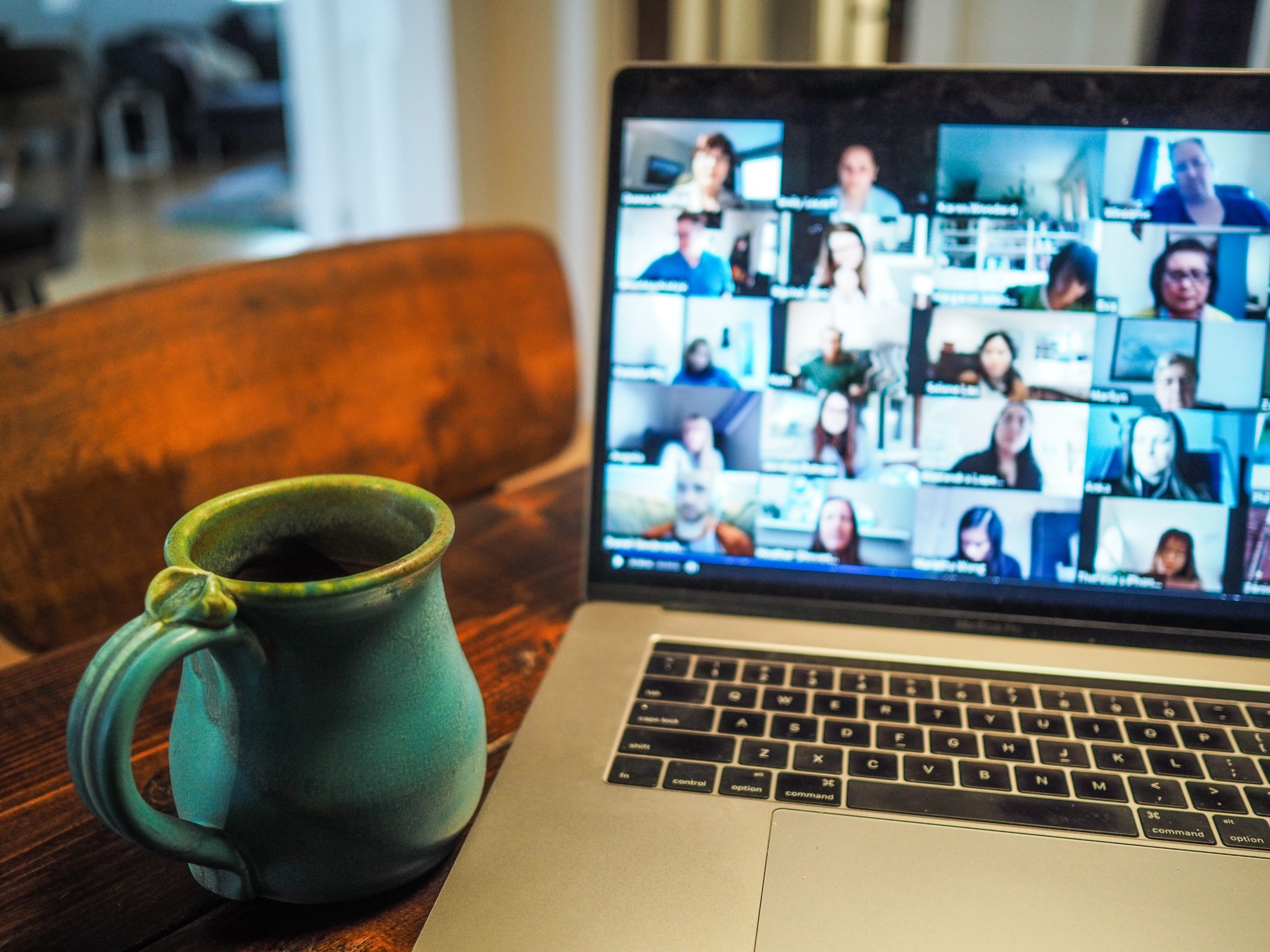 laptop on table with coffee mug